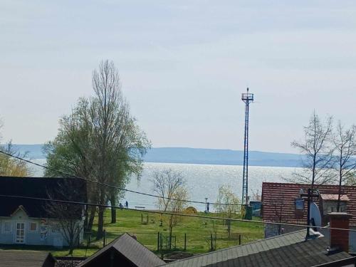 a view of a large body of water at Lent a Parton Apartmanház in Balatonudvari