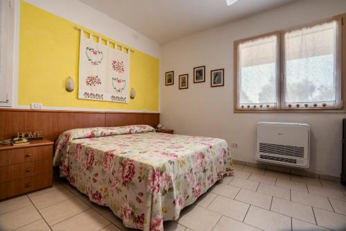 Postel nebo postele na pokoji v ubytování Agriturismo Poggio degli Ulivi