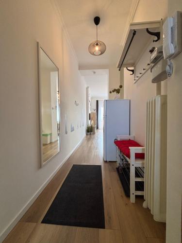 a hallway with a refrigerator in a room at Art-déco in Pécs