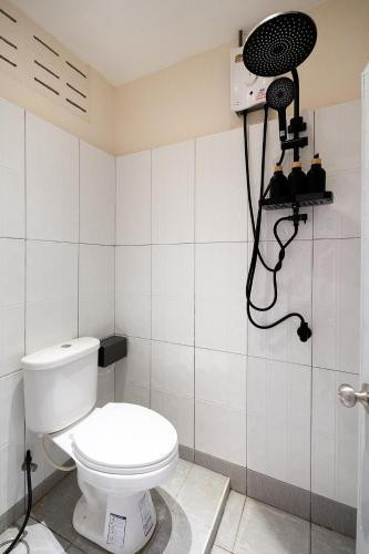 a bathroom with a toilet and a camera on the wall at OH Homes - Samsen 12 in Bangkok