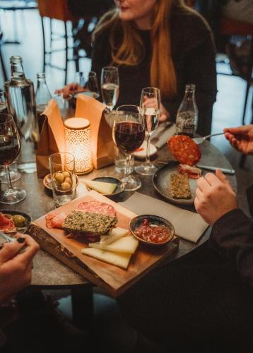 a group of people sitting at a table with food at Vann Spa Hotell & Konferens in Brastad