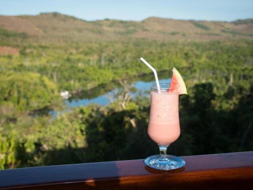 a drink with an orange slice sitting on a table at The Riverhouse in Coron