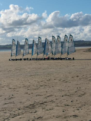 a group of sailboats on a sandy beach at Le Roc'h Mousse Gîte de Charme en Centre Finistère in Plonévez-du-Faou
