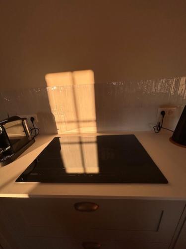 a kitchen counter with two stacks of paper towels at Au 8 à Meursault, Magnifique maison Bourguignonne au pied des vignes, jardin, places de parking privée in Meursault
