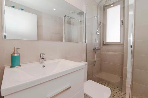 a bathroom with a sink and a shower at Apartments Beach 4U - Can Pastilla in Can Pastilla