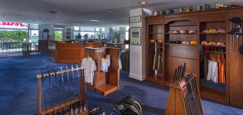 a room with a store with baseball equipment in it at Pickalbatros Hôtel Du Golf - Adults Friendly 16 Years Plus- All-Inclusive in Marrakech