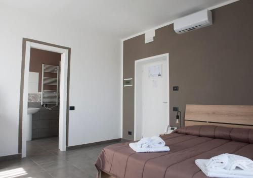 Postel nebo postele na pokoji v ubytování Hotel Riesco