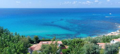 an aerial view of a beach with the ocean at Hotel Villaggio Stromboli in Santa Domenica