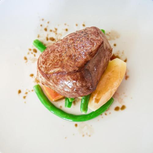 a piece of meat on top of a white plate at Pickalbatros Hôtel Du Golf - Adults Friendly 16 Years Plus- All-Inclusive in Marrakech