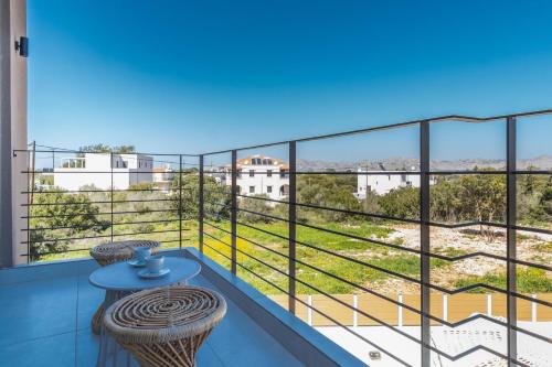 a balcony with a view of the city at Nos Aqua Villas Chania in Pazinos