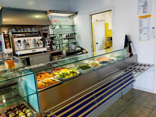 a buffet line with many different types of food at BluBed Mare - Quadrupla Bagno Cucina e Balcone in San Giovanni Teatino