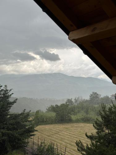 a view of a field with a mountain in the background at konaku in Tomin