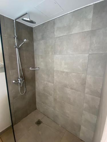 a shower with a glass door in a bathroom at Kikere Studios in Puerto del Carmen