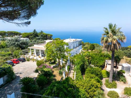 an aerial view of a house with the ocean in the background at Hotel Bellavista in Anacapri