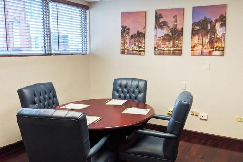 a conference room with a table and chairs at Holiday Inn Hotel Port of Miami-Downtown by IHG in Miami