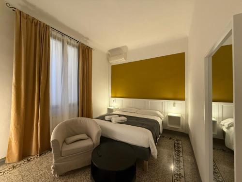 Ένα ή περισσότερα κρεβάτια σε δωμάτιο στο Yome - Your Home in Florence