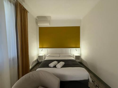 Ένα ή περισσότερα κρεβάτια σε δωμάτιο στο Yome - Your Home in Florence