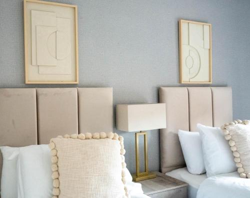 a living room with a couch and a lamp at Stirling Street Stays in Tillicoultry