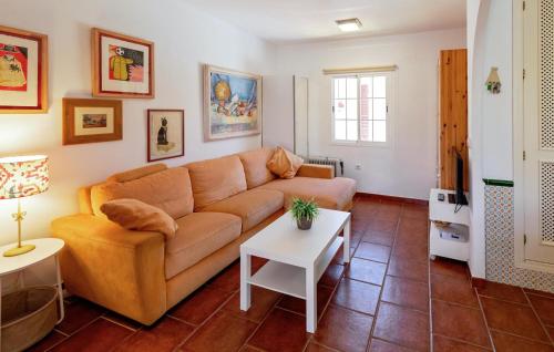 a living room with a couch and a table at Awesome Home In Islantilla - Lepe in Islantilla
