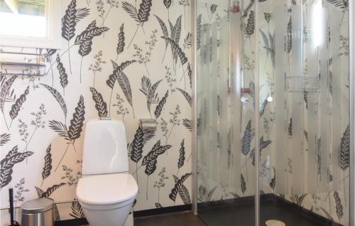 a bathroom with a toilet and a shower at 5 Bedroom Beautiful Home In Björketorp in Björketorp