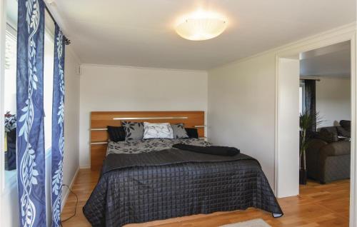 a bedroom with a bed in a room at 5 Bedroom Beautiful Home In Björketorp in Björketorp
