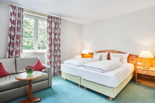 Postel nebo postele na pokoji v ubytování Hotel Freisinger Hof