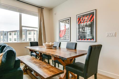 a dining room with a wooden table and chairs at 25 Mi to Zion Rock n Roll Condo with Mtn View! in Hurricane