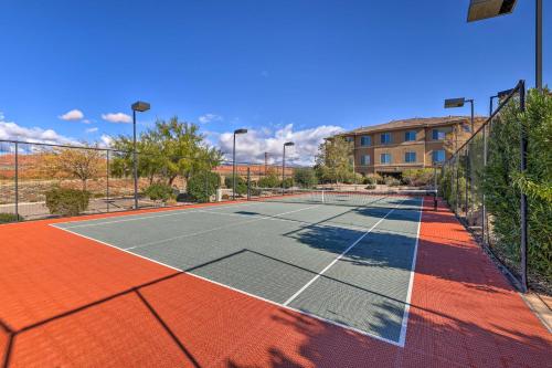 a tennis court in front of a building at 25 Mi to Zion Rock n Roll Condo with Mtn View! in Hurricane