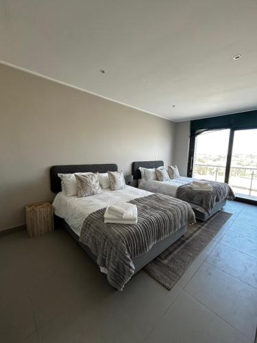 En eller flere senge i et værelse på The Pier 18