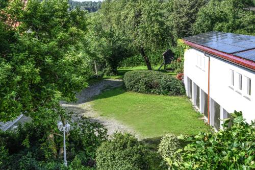 an aerial view of a yard next to a house at Landhotel Adler in Deggenhausertal