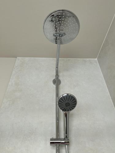 a lamp on top of a floor in a room at Salty Breeze in Noordwijk