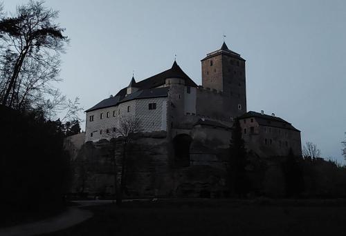 an old castle sitting on top of a hill at Vila Kost Apartman 2 in Libošovice