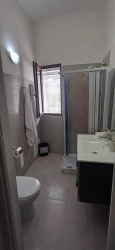a bathroom with a toilet and a sink and a shower at Sardinia Del Sud in Porto Columbu - Perdʼe Sali