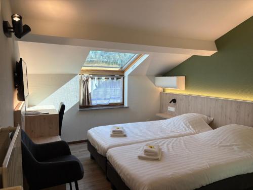 Postel nebo postele na pokoji v ubytování Hotel Monika