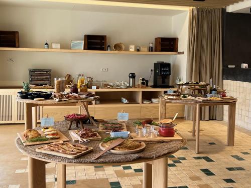 a table filled with different types of food at Hotel Serawa Moraira in Moraira