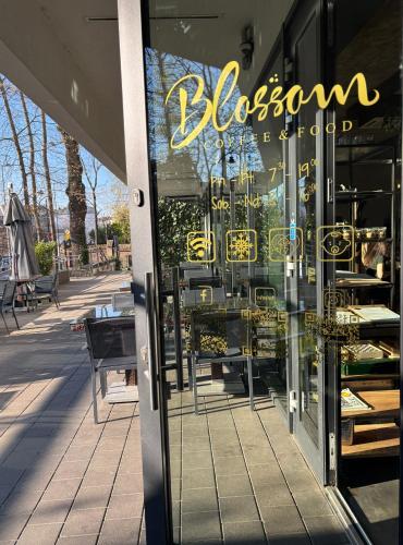 a storefront window of a store with tables and chairs at Central Apartments by Bed&Bath in Kraków