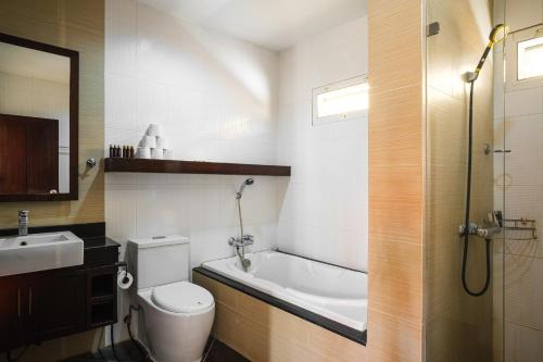 a bathroom with a toilet and a sink and a bath tub at Royal SPA Massarossa Pool Villa Pattaya-23 in Pattaya Central