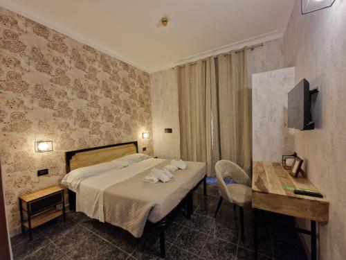 Postel nebo postele na pokoji v ubytování Hotel Agorà