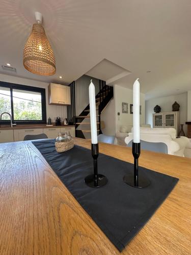 a room with a table with two candles on it at les gites de la Fée in Cavaillon