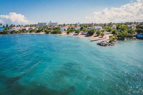 an aerial view of a beach in the ocean at Romantic Dorado Beach Studio in Dorado