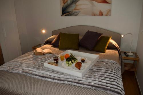 a tray of food sitting on top of a bed at Orvieto Residence in Orvieto