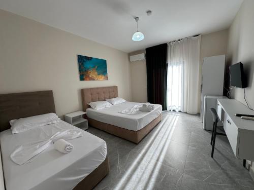 Postel nebo postele na pokoji v ubytování Molla Hotel Restorant