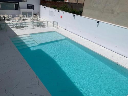 Πισίνα στο ή κοντά στο Hostal La Paz