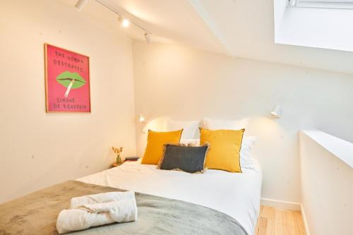 Ένα ή περισσότερα κρεβάτια σε δωμάτιο στο Chez Camille - Boutique Aparthotel au coeur de Bordeaux