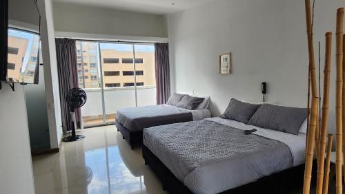 Aparta-Suite Dúplex de Lujo客房内的一张或多张床位