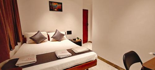 Katil atau katil-katil dalam bilik di Woodlands Inn