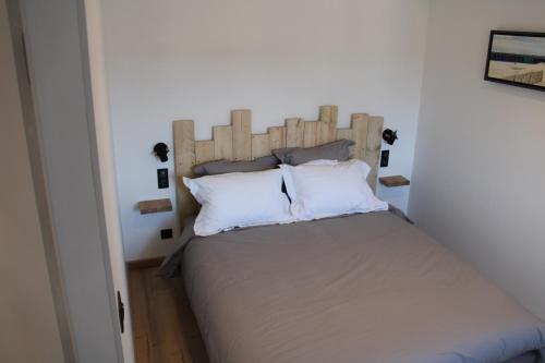 Cama o camas de una habitación en Sables Appartement