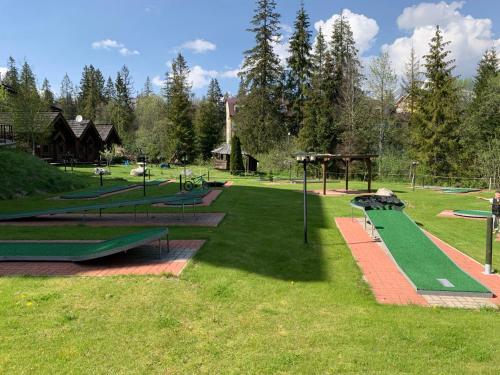 a park with a bunch of playground equipment at Apartmán DEJA VÚ - Tatranská Štrba in Štrba
