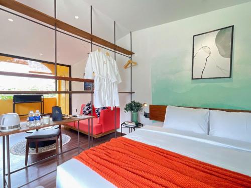 Postel nebo postele na pokoji v ubytování Joi Boutique Bãi Trước