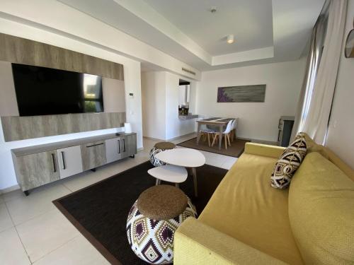 a living room with a couch and a table at alhoceima vip safiha in Al Hoceïma